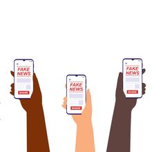 Illustration shows multiple hands holding phones displaying &ldquo;fake news&rdquo; on the screen.&nbsp;