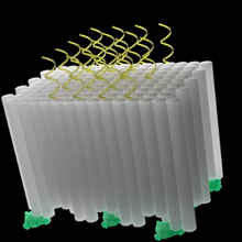 Cuboidal DNA origami block containing parallel double helices (gray columns) decorated with tumor antigens (green proteins) and CpG adjuvants (yellow helices) on opposing faces.